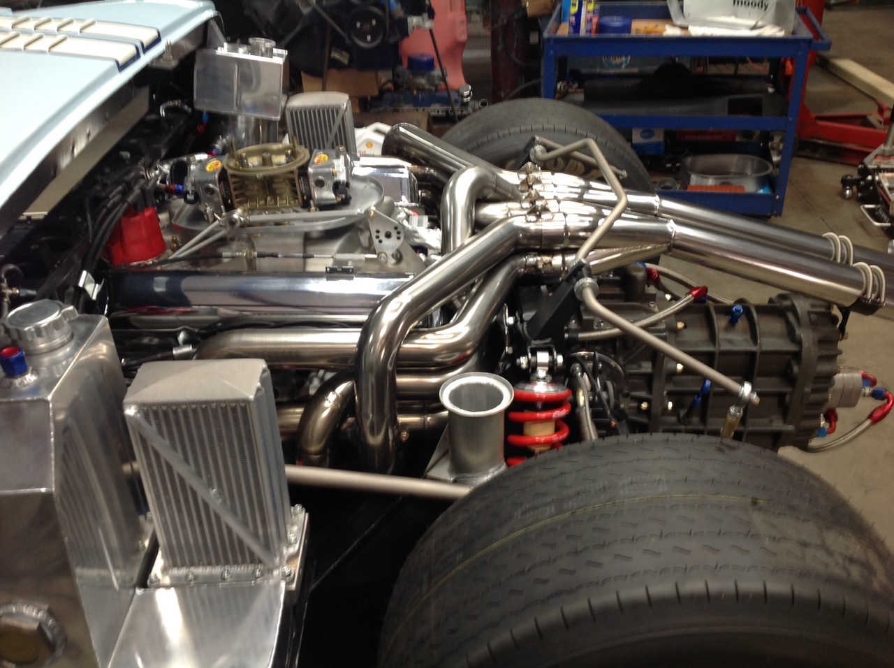 Equal-length headers fitted into the GT40 engine bay and transaxle